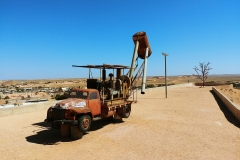 Coober Pedy - Drilling truck and tree